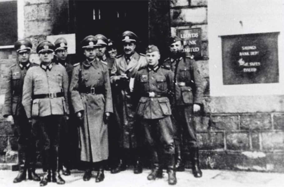 Oberst Schumacher inspects the accounts office of the German Field Command at  Lloyd's Bank, Victoria Street.